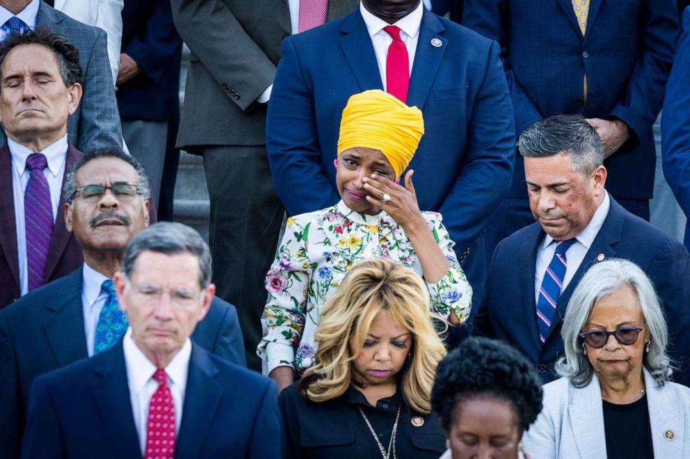 PHOTO: Rep. Ilhan Omar tears up during a moment of silence for 600,000 American lives lost to COVID-19, outside the US Capitol in Washington, D.C., June 14, 2021.