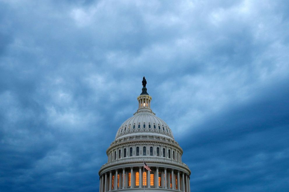 Clouds roll over the U.S. Capitol dome as dusk approaches in Washington on June 12, 2019. 