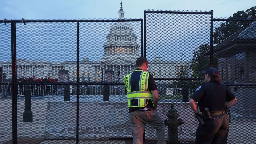 PHOTO: U.S. Capitol Police officers look over the integrity of the fence put up to secure the US Capitol  and its grounds in advance of 9/18 Justice for J6 rally, Sept. 16, 2021, in Washington, D.C.