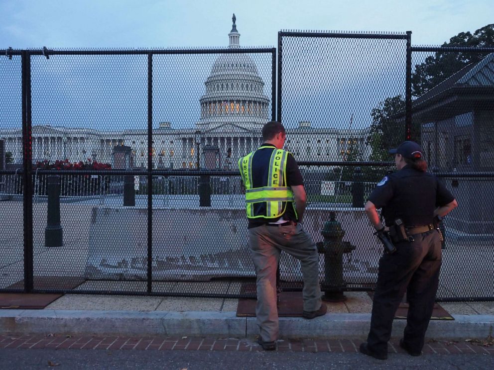 PHOTO: U.S. Capitol Police officers look over the integrity of the fence put up to secure the US Capitol  and its grounds in advance of 9/18 Justice for J6 rally, Sept. 16, 2021, in Washington, D.C.