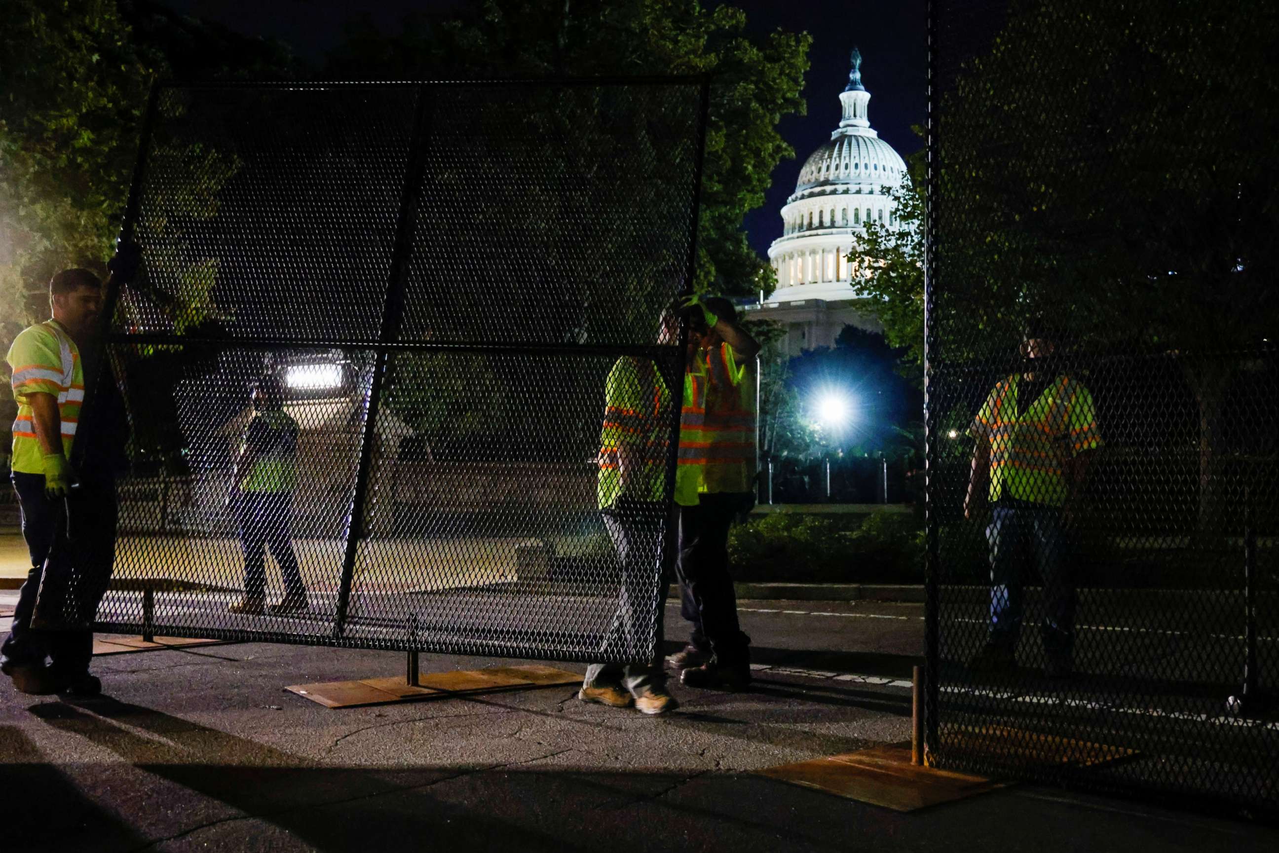 PHOTO: Workers install a security fence around the U.S. Capitol on Sept. 15, 2021, ahead of an expected rally on Saturday in support of the Jan. 6 defendants in Washington.