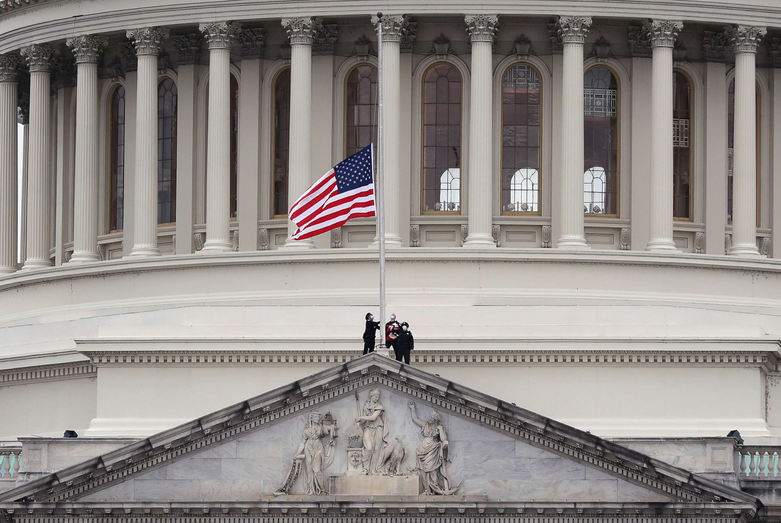 PHOTO: The American flag is lowered to half-staff atop the U.S. Capitol Building following the death of a U.S. Capitol Police Officer, Jan. 8, 2021, in Washington, D.C.