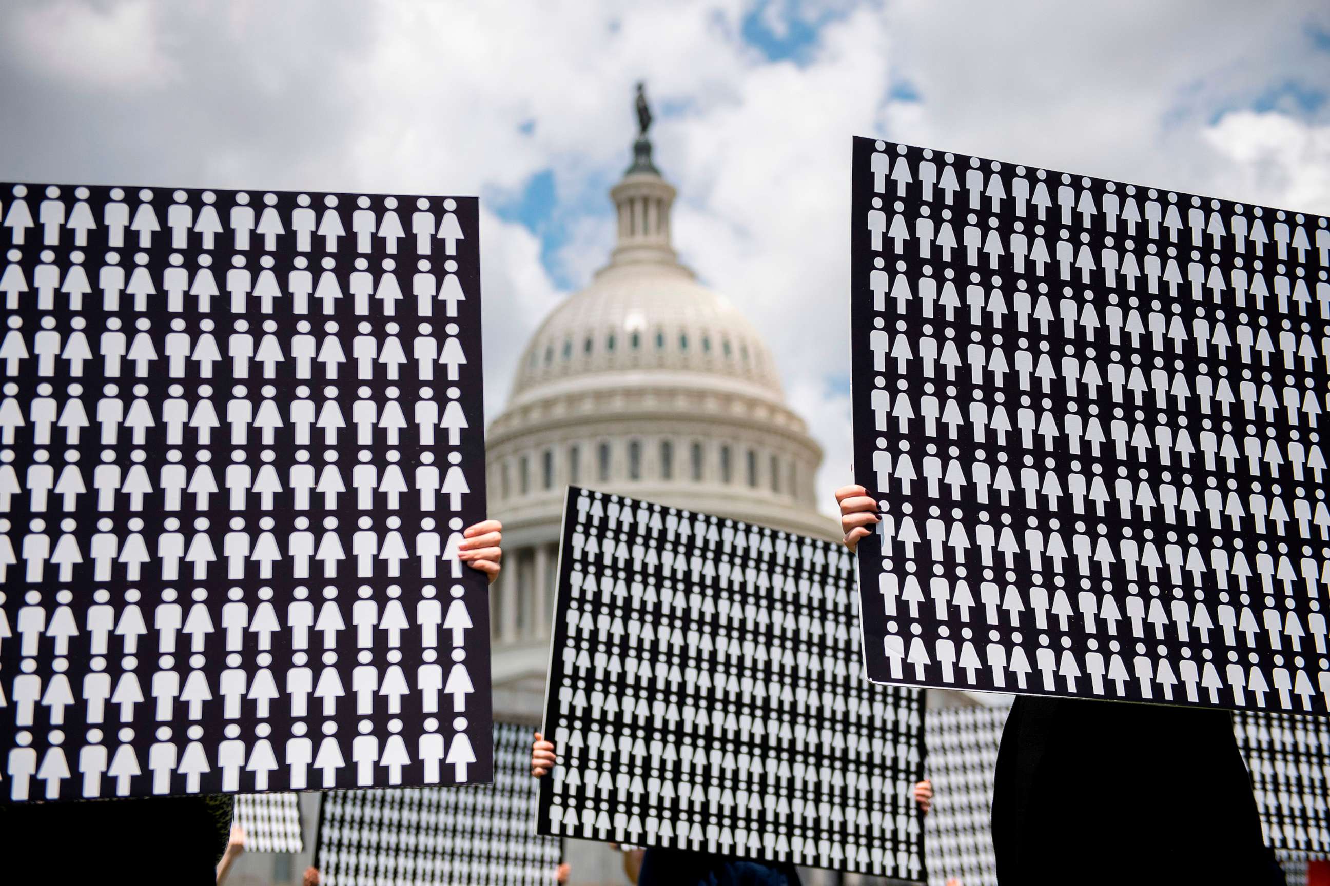PHOTO: Demonstrators hold up placards representing the number of the people who have died due to gun violence on Capitol Hill in Washington, D.C. on June 20, 2019, during an event with gun violence prevention advocates.
