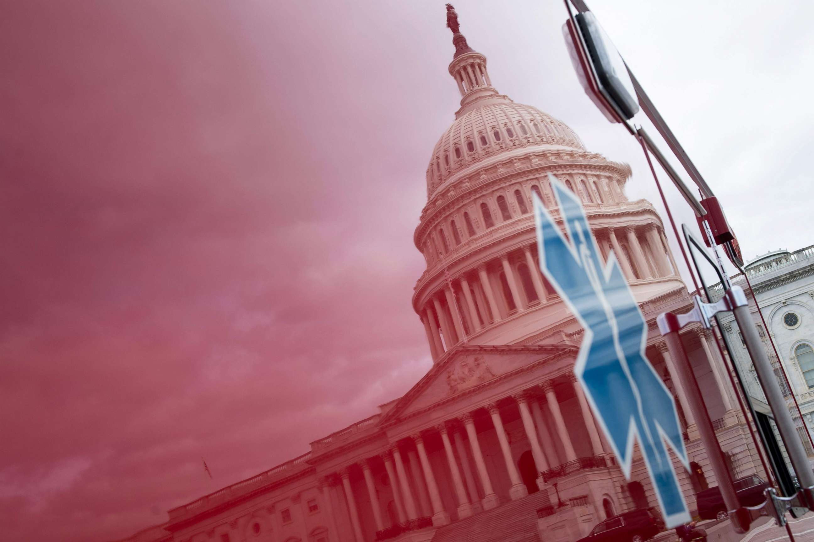 PHOTO: A view of the Capitol's Rotunda is seen reflected in an ambulance as negotiations on a COVID-19 economic bailout continue on Capitol Hill, March 24, 2020, in Washington.