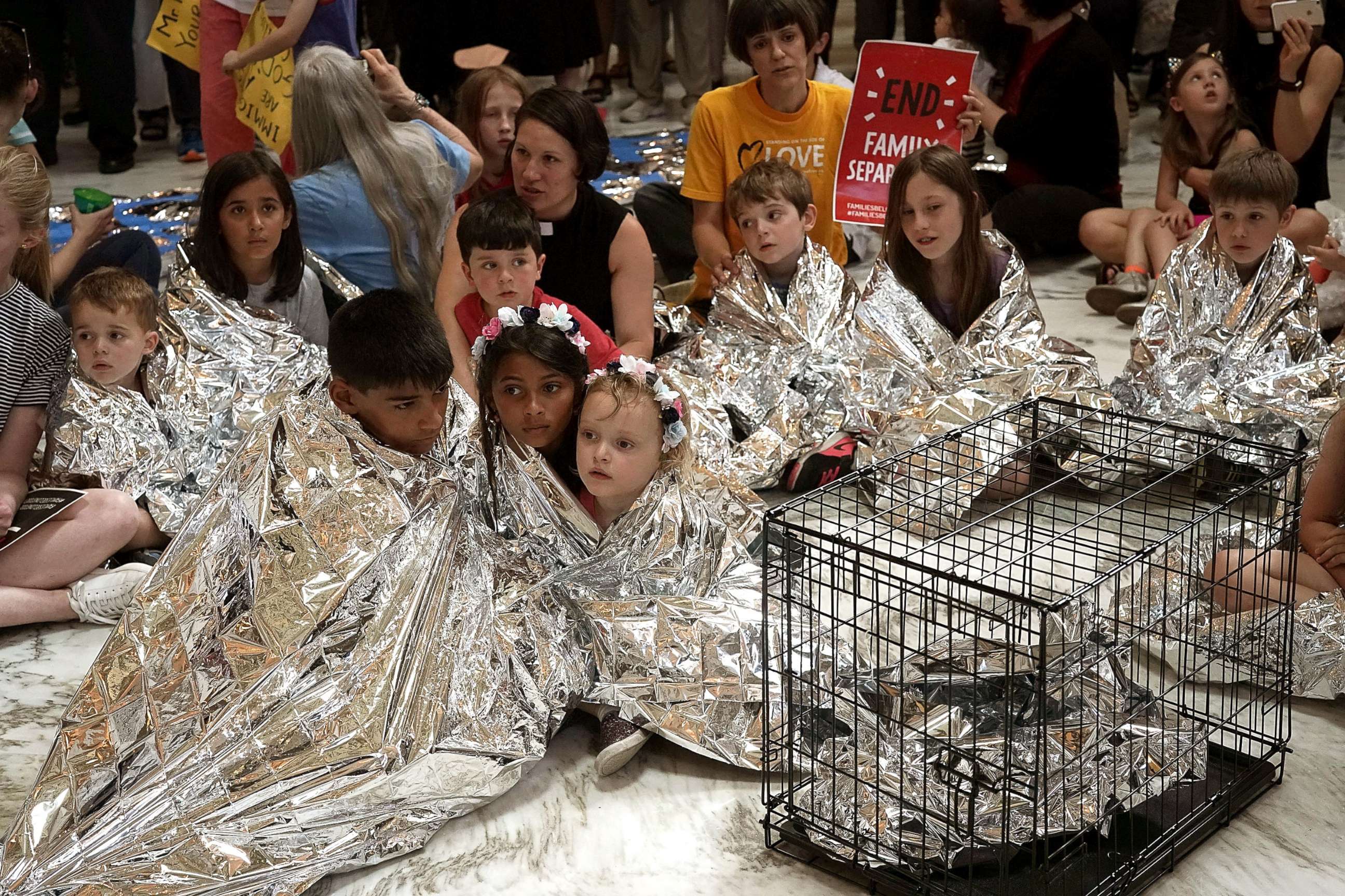 PHOTO: Activists staged a demonstration to protest the Trump Administration's policy to separate migrant families at the southern border at the rotunda of Russell Senate Office Building June 21, 2018 on Capitol Hill in Washington, D.C.