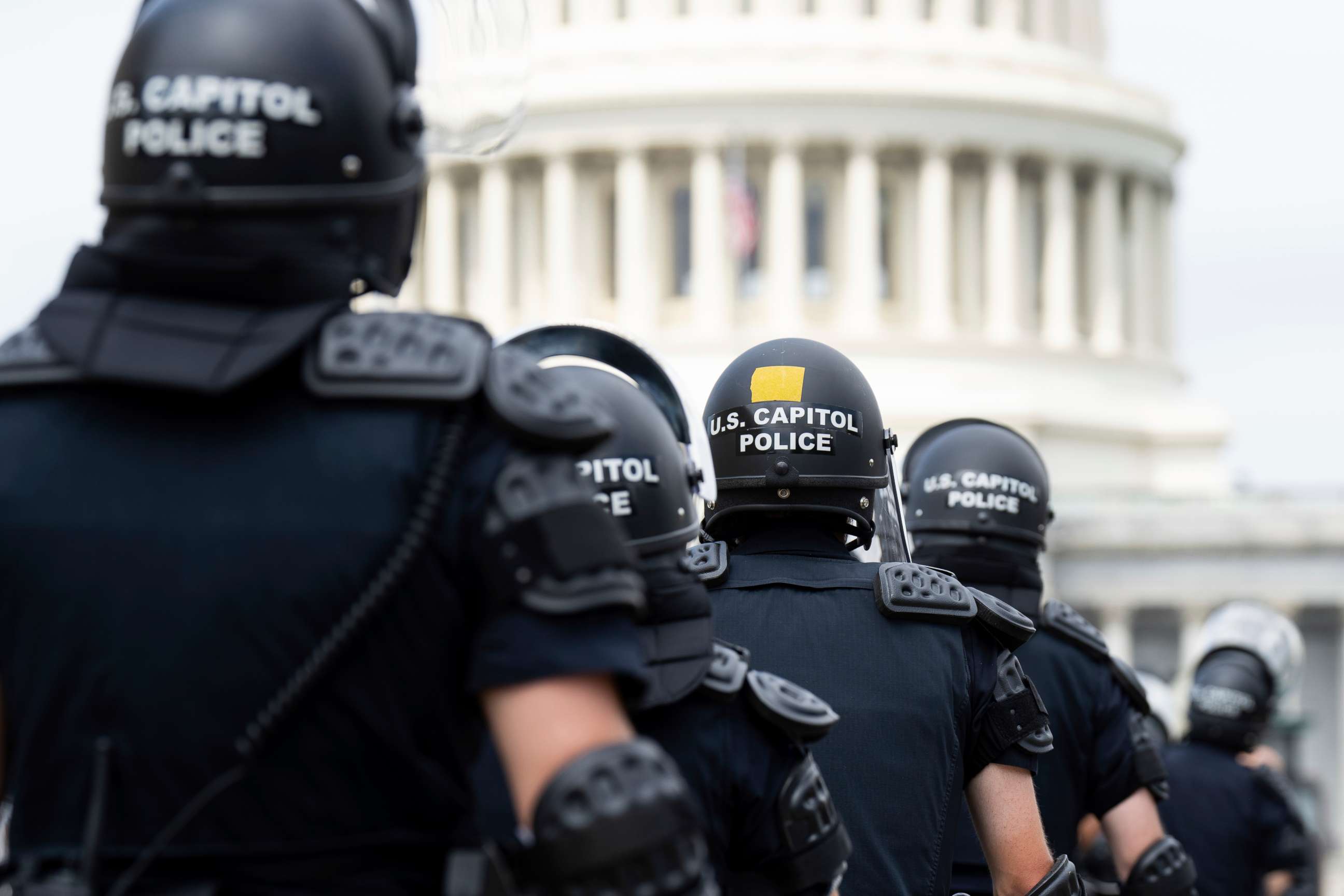 PHOTO: U.S. Capitol Police in riot gear return to their staging area after clear a path back to the Capitol, June 24, 2022.