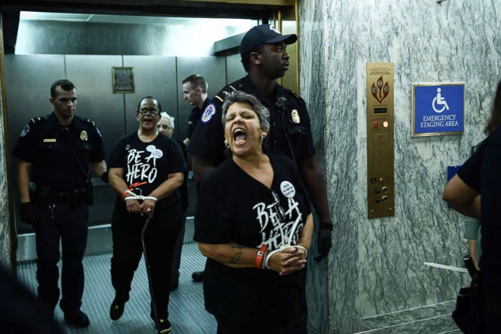 PHOTO: US Capitol Police arrest demonstrators during a protest against the nomination of Judge Brett Kavanaugh to be a Supreme Court Justice on Capitol Hill in Washington, DC, Sept. 26, 2018. 