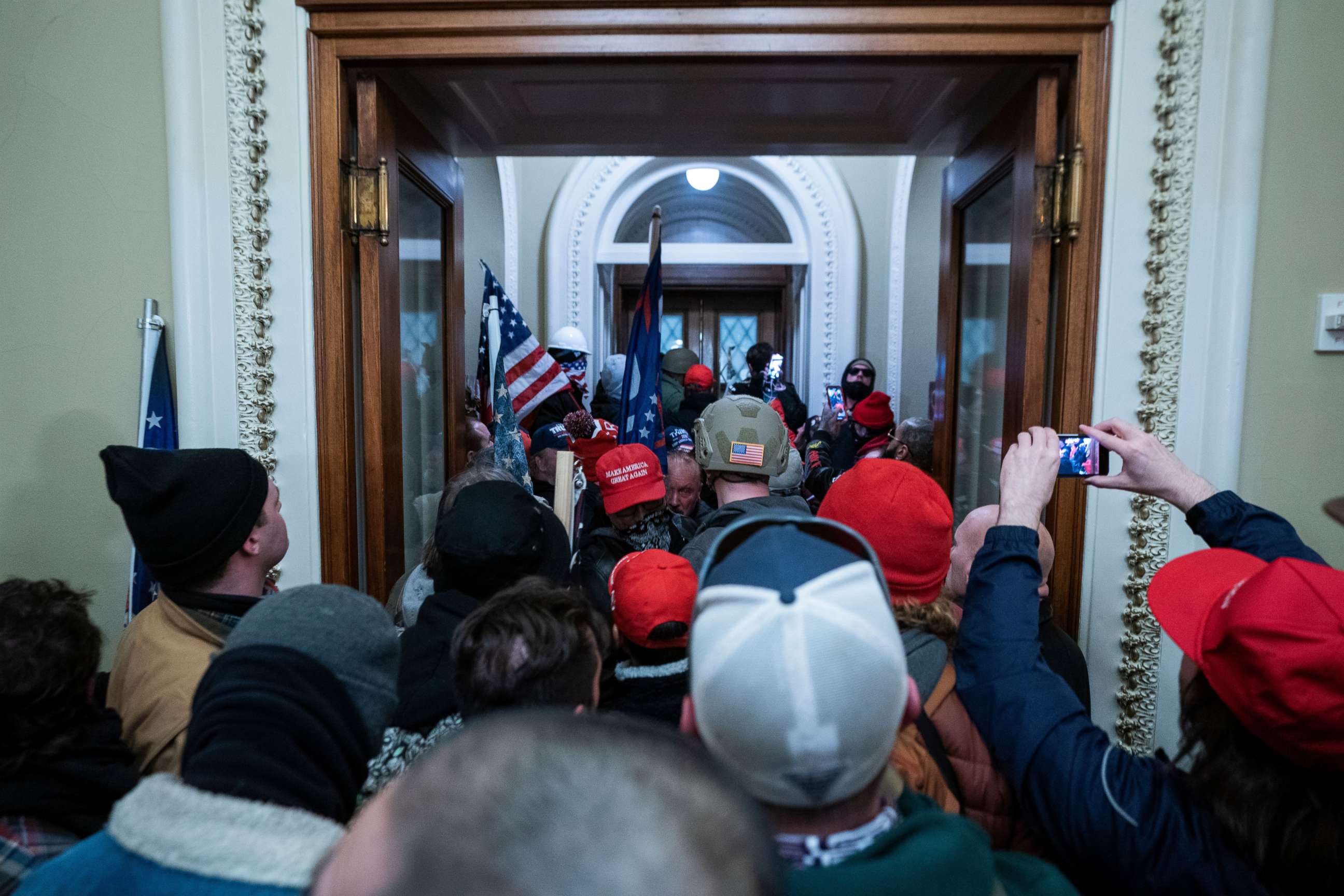 PHOTO: Supporters of President Donald Trump press through the door to the House chamber after breaching Capitol security in Washington, D.C., Jan. 6, 2021.
