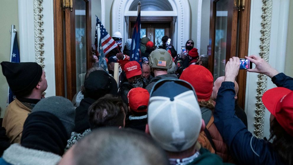 PHOTO: Supporters of President Donald Trump press through the door to the House chamber after breaching Capitol security in Washington, D.C., Jan. 6, 2021.