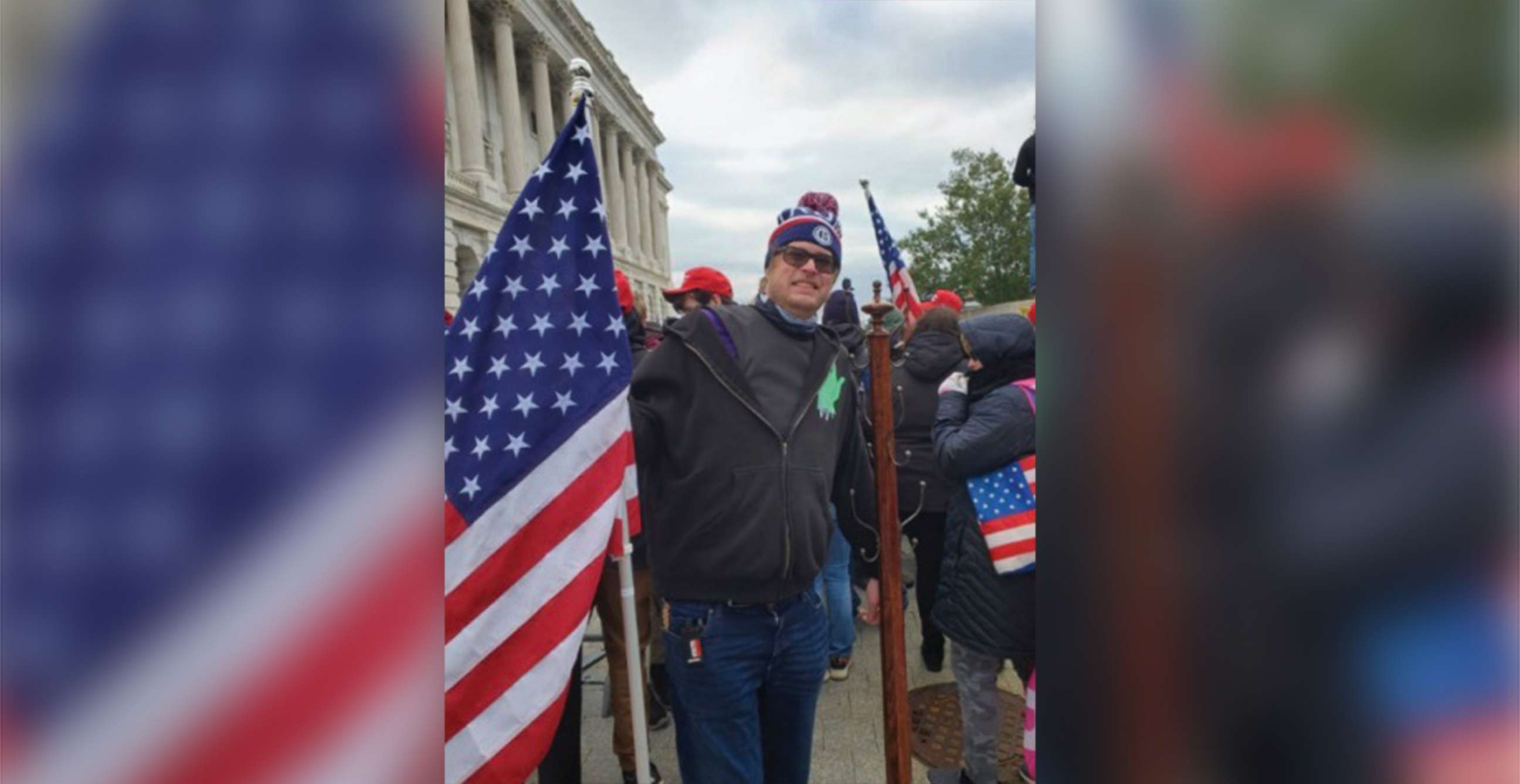 PHOTO: Dustin Thompson poses with a stolen coat rack during the riots after the Stop the Steal rally during which the security of the Capitol was breached in Washington, Jan. 6, 2022 in an evidence photo released during his trial.
