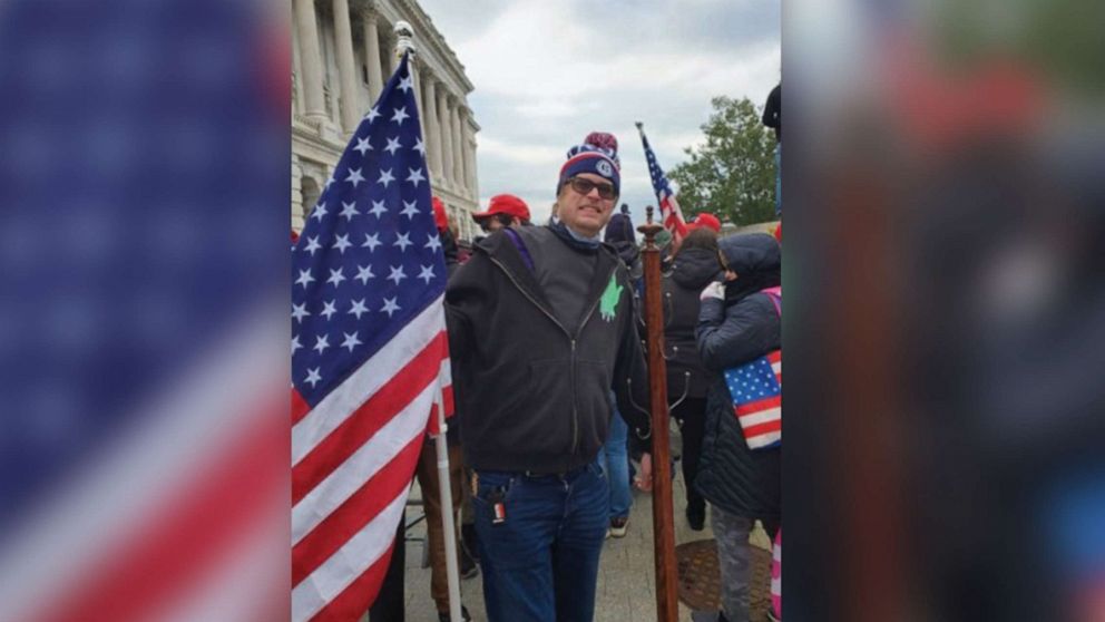 PHOTO: Dustin Thompson poses with a stolen coat rack during the riots after the Stop the Steal rally during which the security of the Capitol was breached in Washington, Jan. 6, 2022 in an evidence photo released during his trial.