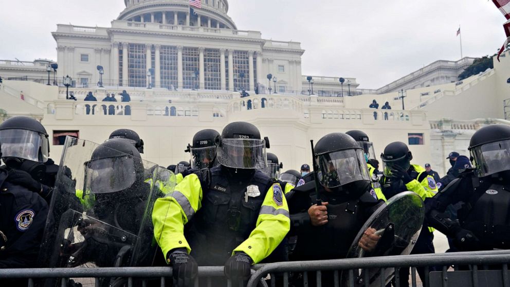 PHOTO: Police try to hold back protesters who gather to storm the Capitol and halt a joint session of the 117th Congress on Jan. 6, 2021, in Washington.