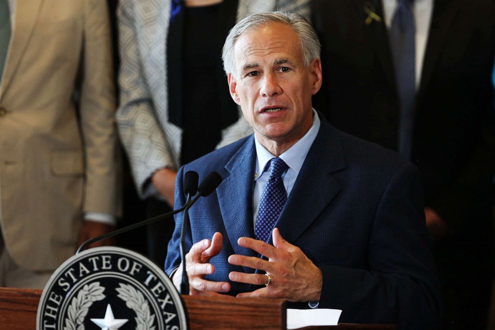 PHOTO: Texas Governor Greg Abbott speaks at City Hall in Dallas, July 8, 2021.