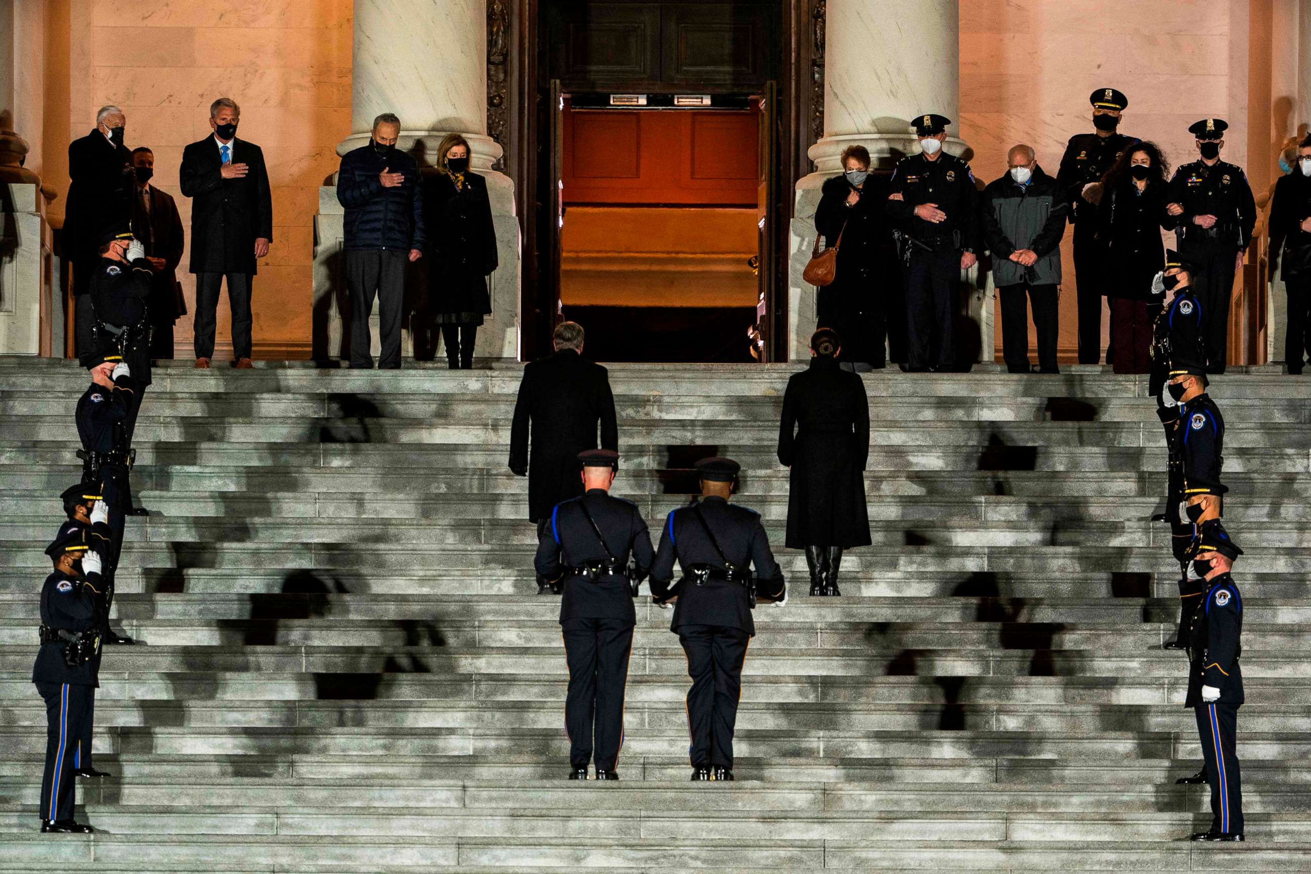 PHOTO: Honor guards carry an urn with the cremated remains of late U.S. Capitol Police officer Brian Sicknick, who died while protecting the Capitol during the Jan. 6 attack, up the steps of the Capitol to lie in honor in the Rotunda, Feb. 2, 2021.