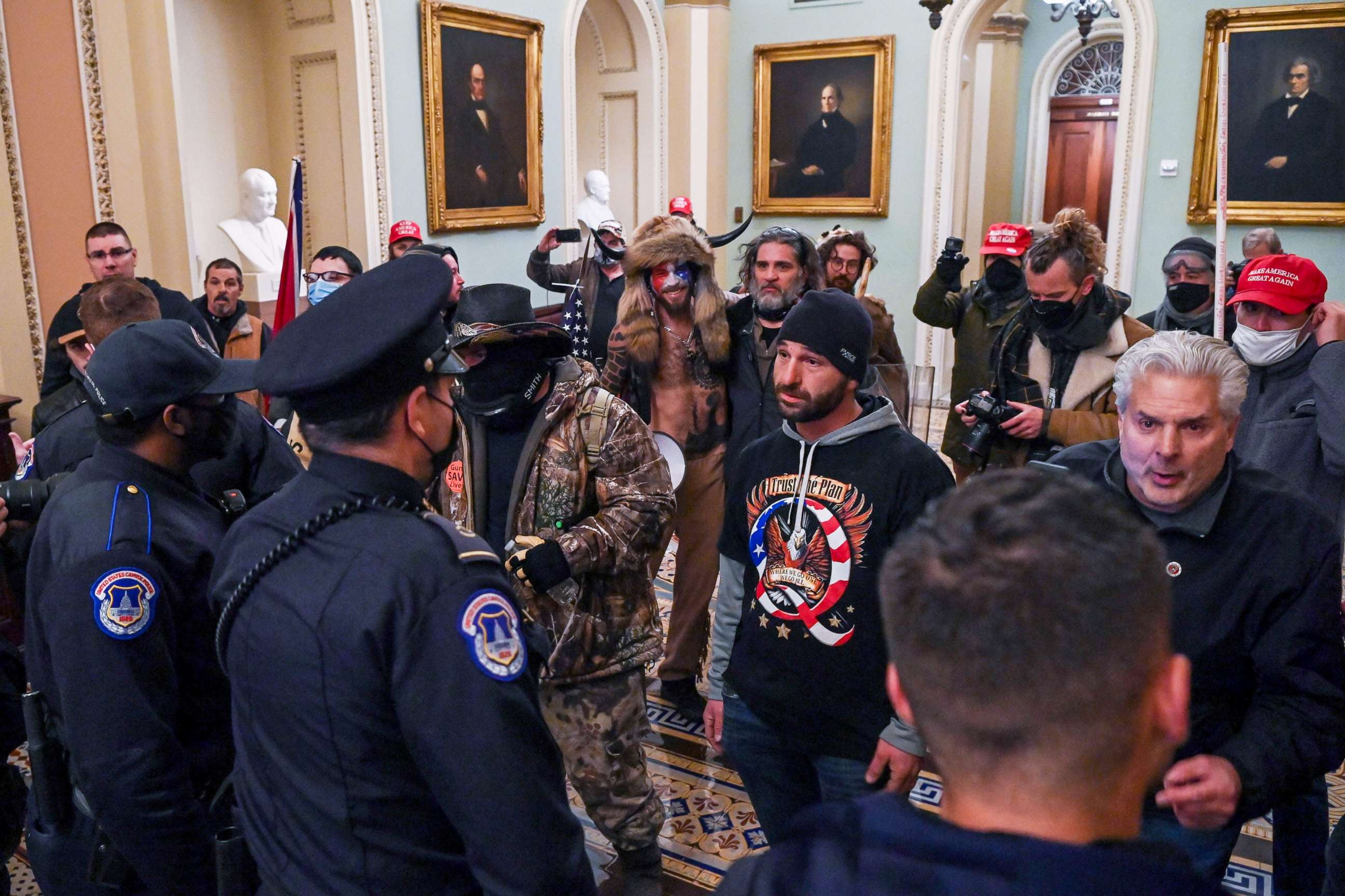 PHOTO: Dominic Pezzola stands among the crowd of supporters of President Donald Trump as they confront Capitol police officers trying to stop them from further entering the Capitol after security was breached in Washington, Jan. 6, 2021.