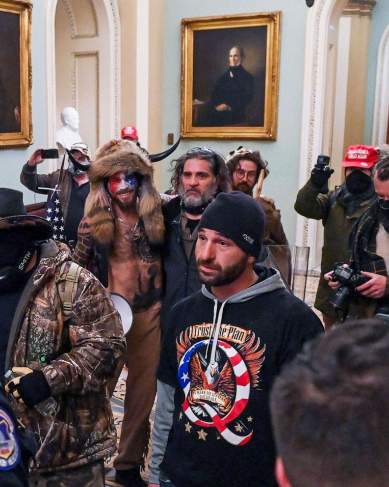 PHOTO: Dominic Pezzola stands among the crowd of supporters of President Donald Trump as they confront Capitol police officers trying to stop them from further entering the Capitol after security was breached in Washington, Jan. 6, 2021.