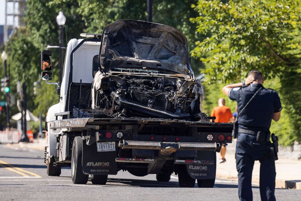 PHOTO: A tow truck removes a car that crashed into a Capitol barricade in Washington, Aug. 14, 2022.