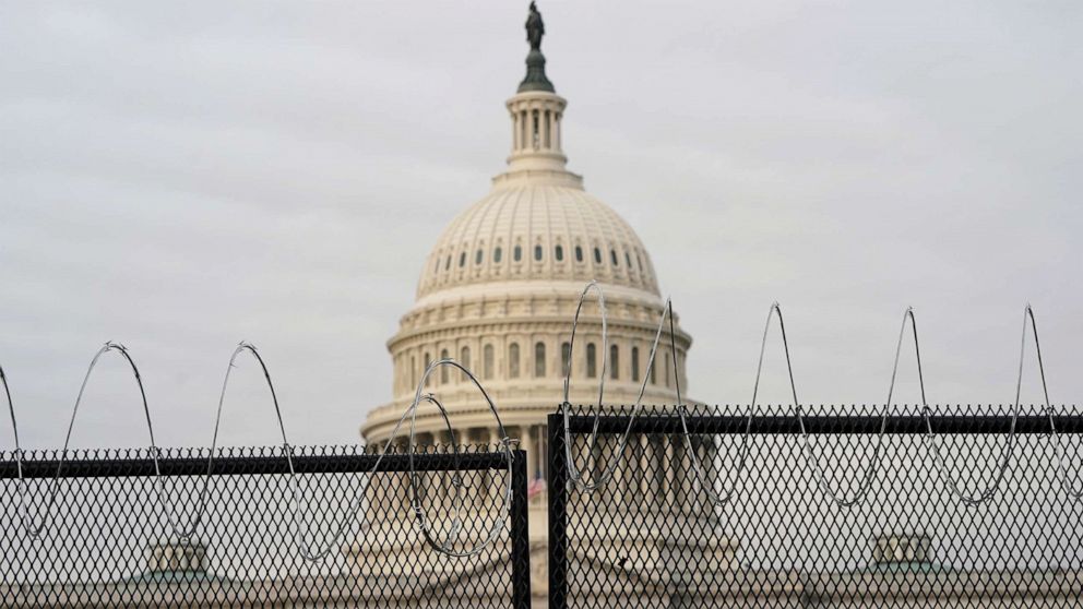 PHOTO: The dome of the U.S. Capitol seen behind barbed wire, as the second impeachment trial of former U.S. President Donald Trump is scheduled to begin in Washington, D.C., Feb. 9, 2021.