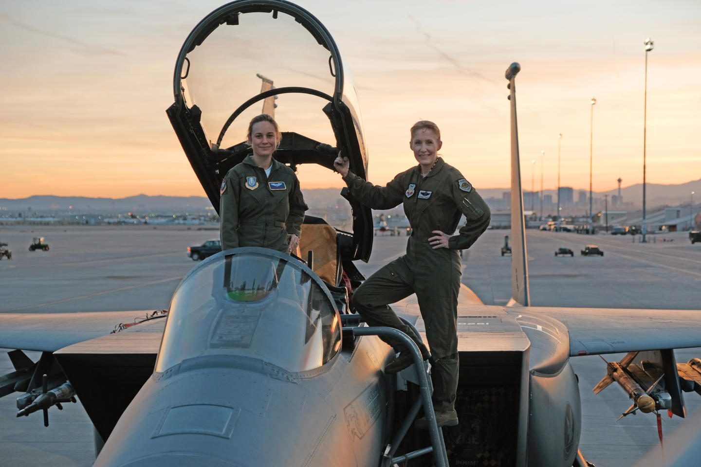 PHOTO: Brie Larson gets hands-on help from Brigadier General Jeannie Leavitt, 57th Wing Commander, on a trip to Nellis Air Force Base in Nevada to research her character, for the film, "Captain Marvel."