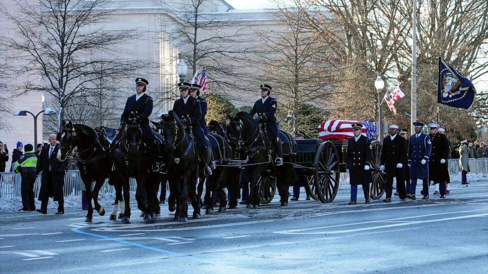 PHOTO: The flag-draped casket of former President Jimmy Carter travels by a horse-drawn caisson to the US Capitol to lie in state in Washington, DC, on January 7, 2025. 