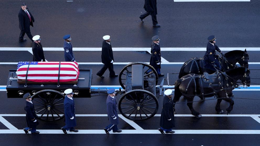 PHOTO: The flag-draped casket of former President Jimmy Carter travels by a horse-drawn caisson to the US Capitol to lie in state in Washington, DC, on January 7, 2025. 