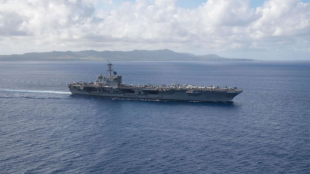 PHOTO: The aircraft carrier USS Theodore Roosevelt (CVN 71) operates in the Philippine Sea, May 21, 2020, following an extended visit to Guam in the midst of the COVID-19 global pandemic.