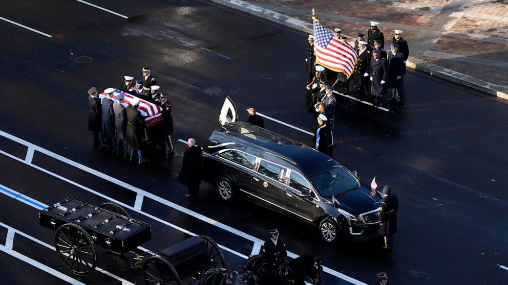 PHOTO: The flag-draped casket of former President Jimmy Carter is transferred to a horse-drawn caisson at the U.S. Navy Memorial before traveling on to the Capitol in Washington, D.C., on Jan. 7, 2025. 