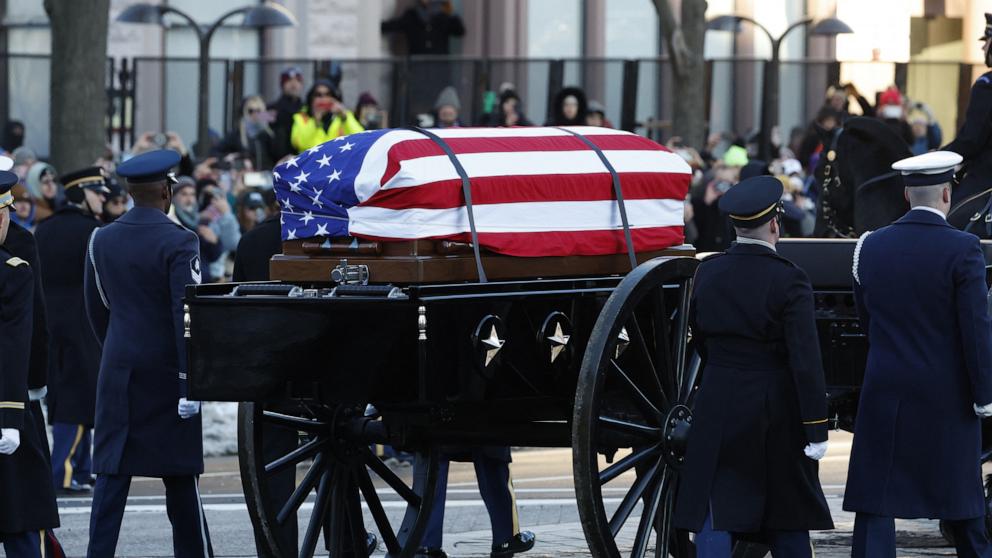 PHOTO: A horse-drawn caisson carries the flag-draped casket of former President Jimmy Carter as the State Funeral Procession departs the US Navy Memorial and heads to the Capitol in Washington, DC, on Jan. 7, 2025, where Carter will lie in state.