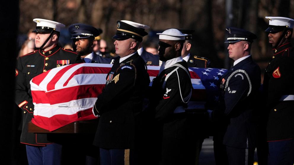 PHOTO: A military body bearer team carries the casket of former President Jimmy Carter at the Jimmy Carter Presidential Library and Museum to lie in repose in Atlanta, Jan. 4, 2025.  