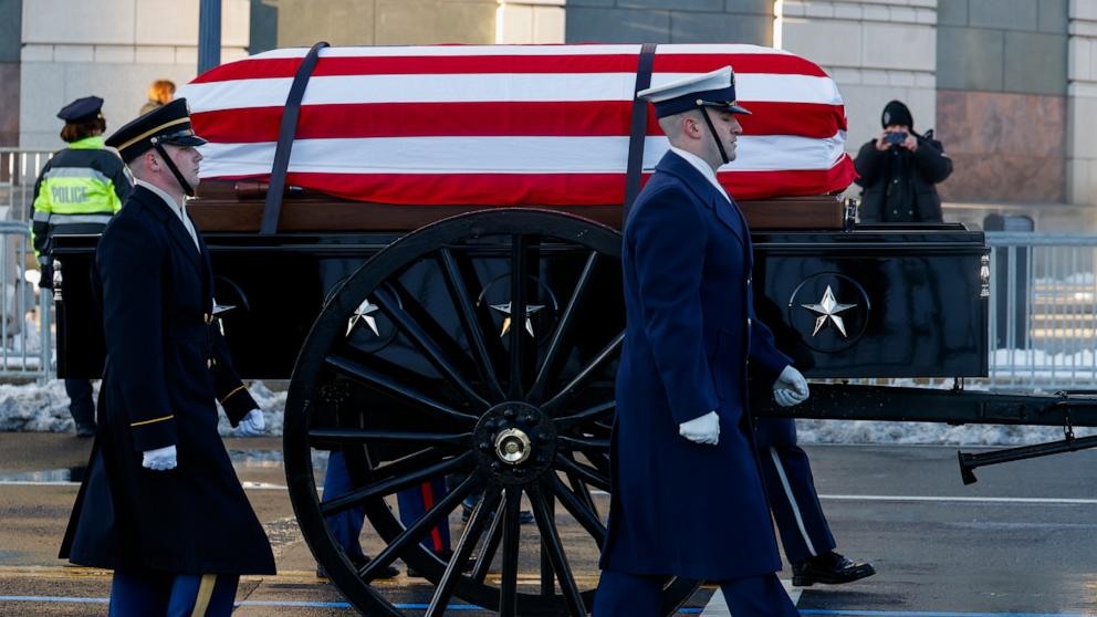 PHOTO: The U.S. Army's Caisson Detachment carries the casket during the funeral procession for Former President Jimmy Carter on January 7, 2025 in Washington, DC. 