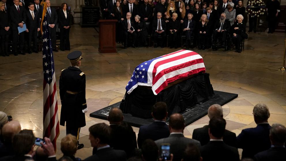 PHOTO: A U.S. flag is draped on the casket of Jimmy Carter, the former president who died on December 29 at the age of 100, as he lies in state in the Rotunda of the U.S. Capitol building in Washington, D.C., Jan. 7, 2025. 