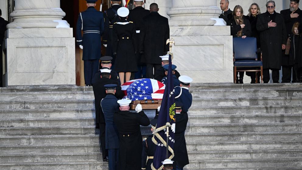 PHOTO: The casket of former President Jimmy Carter is carried to the US Capitol Rotunda, where he will lie in state, in Washington, DC, on January 7, 2025. 