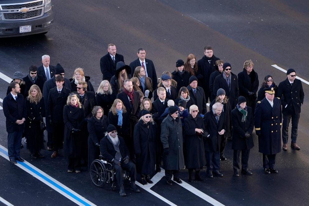 PHOTO: Family members look on as the flag-draped casket of former President Jimmy Carter is transferred to a horse-drawn caisson at the U.S. Navy Memorial before traveling on to the Capitol in Washington, D.C., on Jan. 7, 2025. 