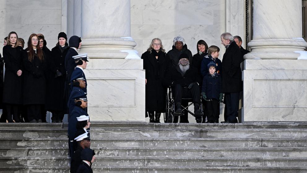 PHOTO: Amy Carter (C), daughter of Jimmy Carter, watches the flag-draped casket of former President Jimmy Carter arrive at the US Capitol to lie in state in Washington, DC, on January 7, 2025. 