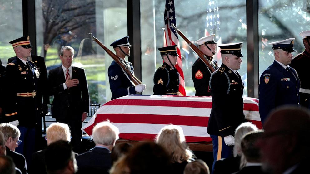 PHOTO: A military body bear team places the flag-draped casket of former President Jimmy Carter onto the catafalque at the Jimmy Carter Presidential Library and Museum in Atlanta, Jan. 4, 2025.  