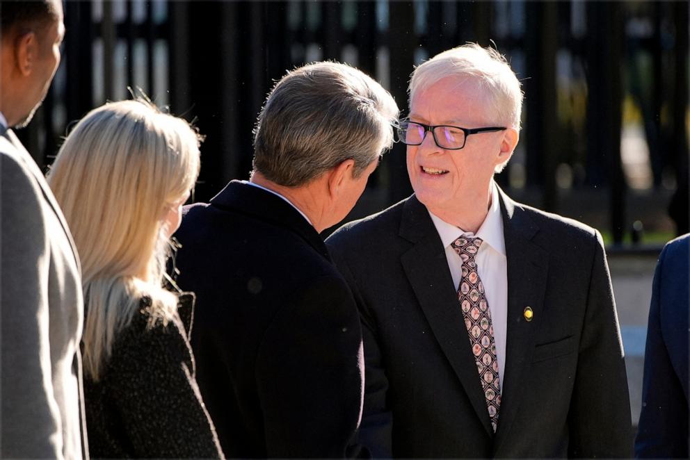 PHOTO: Jack Carter greets Georgia Gov. Brian Kemp as the hearse carrying the flag-draped casket of former President Jimmy Carter pauses outside the State Capitol in Atlanta, Jan. 4, 2025. 