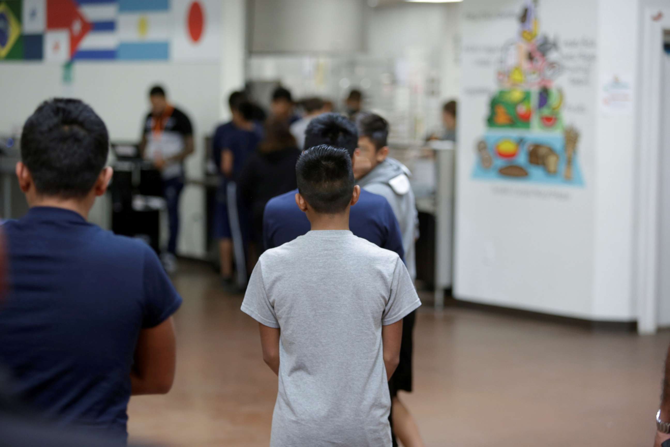 PHOTO: Children stand in line at Casa Padre, an immigrant shelter for unaccompanied minors, in Brownsville, Texas, in a photo released by the Department of Health and Human Services, June 14, 2018.