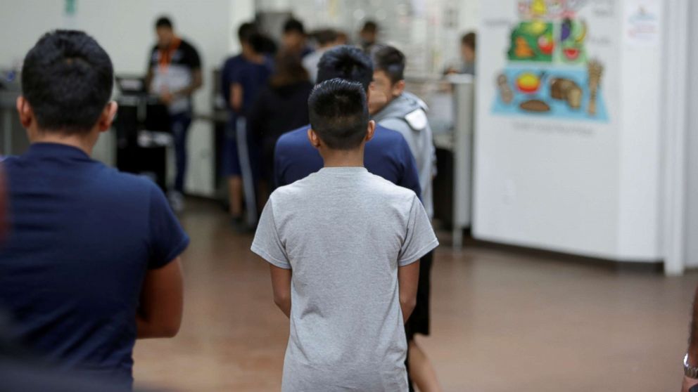 PHOTO: Children stand in line at Casa Padre, an immigrant shelter for unaccompanied minors, in Brownsville, Texas, in a photo released by the Department of Health and Human Services, June 14, 2018.