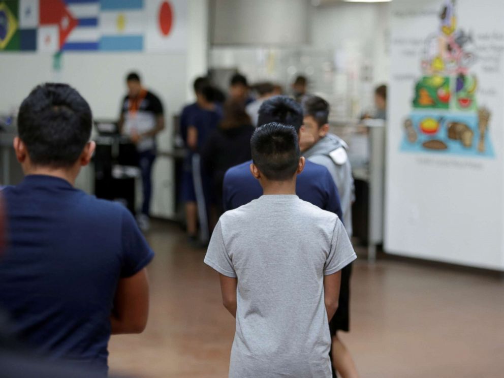 PHOTO: Children stand in line at Casa Padre, an immigrant shelter for unaccompanied minors, in Brownsville, Texas, in a photo released by the Department of Health and Human Services, June 14, 2018.
