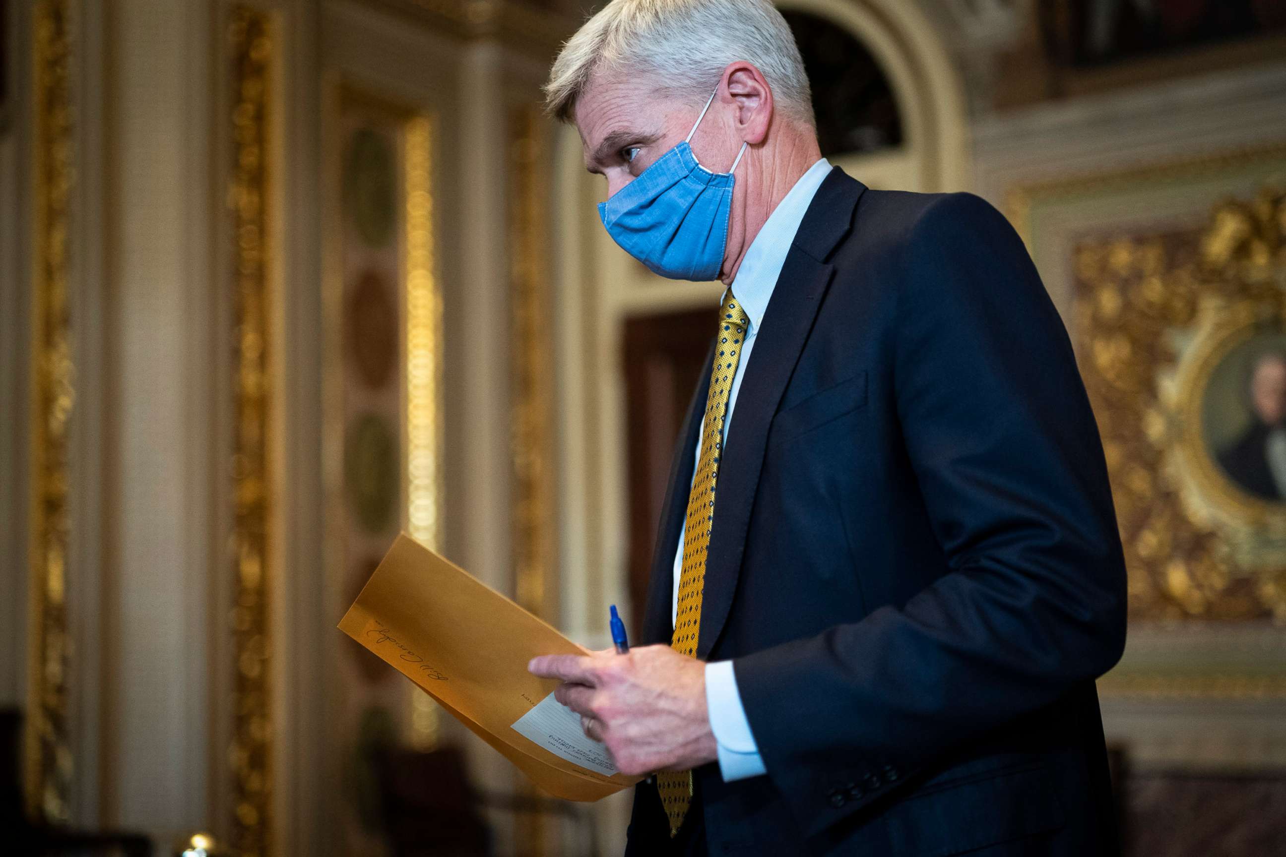 PHOTO: Sen. Bill Cassidy walks in the Senate Reception room on the fourth day of the Senate Impeachment trial for Trump on Capitol Hill, Feb 12, 2021, in Washington, D.C.