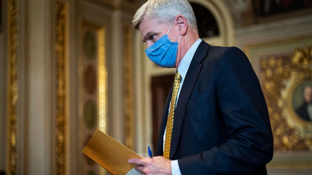 PHOTO: Sen. Bill Cassidy walks in the Senate Reception room on the fourth day of the Senate Impeachment trial for Trump on Capitol Hill, Feb 12, 2021, in Washington, D.C.