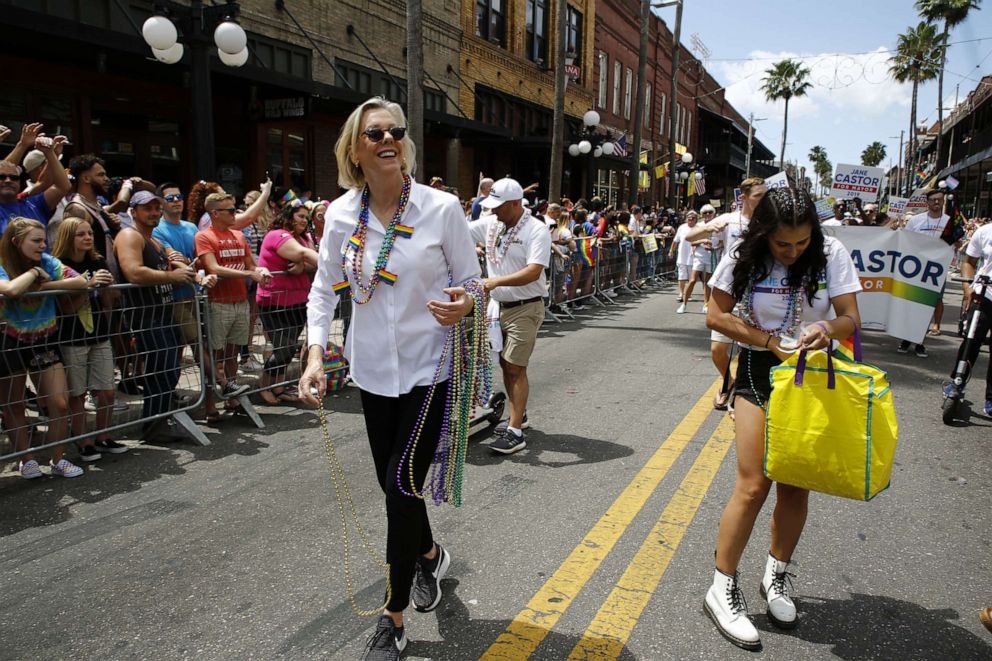 PHOTO: Tampa mayoral candidate Jane Castor hands out beads at the Tampa Pride Diversity parade, March 30, 2019, in Tampa, Fla. 