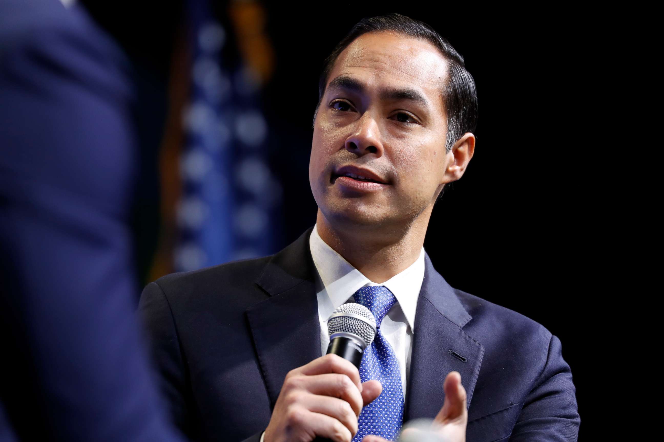 PHOTO: Former Housing and Urban Development Secretary and Democratic presidential candidate Julian Castro listens to a question at the J Street National Conference, with the hosts of "Pod Save the World," Oct. 28, 2019, in Washington.