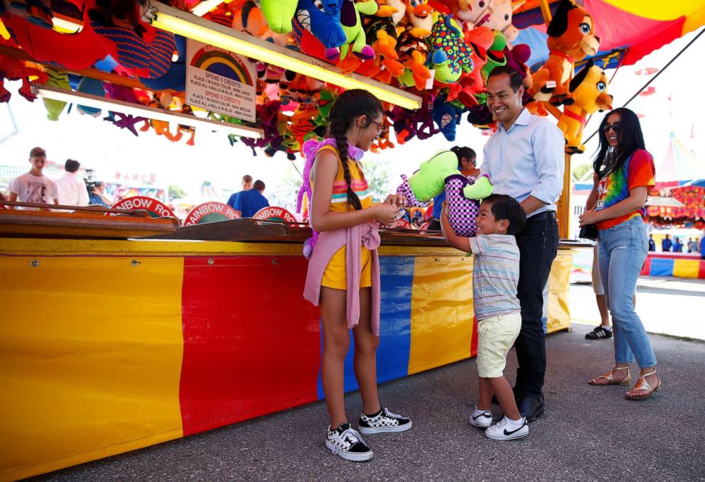 PHOTO: Democratic 2020 U.S. presidential candidate and former HUD Secretary Julian Castro with his wife Erica, their daughter Carina and their son Cristian tour the Iowa State Fair in Des Moines, Iowa, U.S., August 9, 2019.