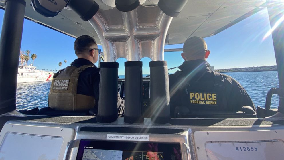 PHOTO: Two CBP air and maritime agents aboard a boat in the port of Los Angeles ahead of Super Bowl Sunday. 
