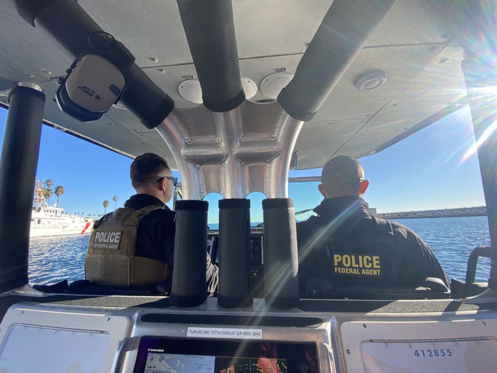 PHOTO: Two CBP air and maritime agents aboard a boat in the port of Los Angeles ahead of Super Bowl Sunday. 