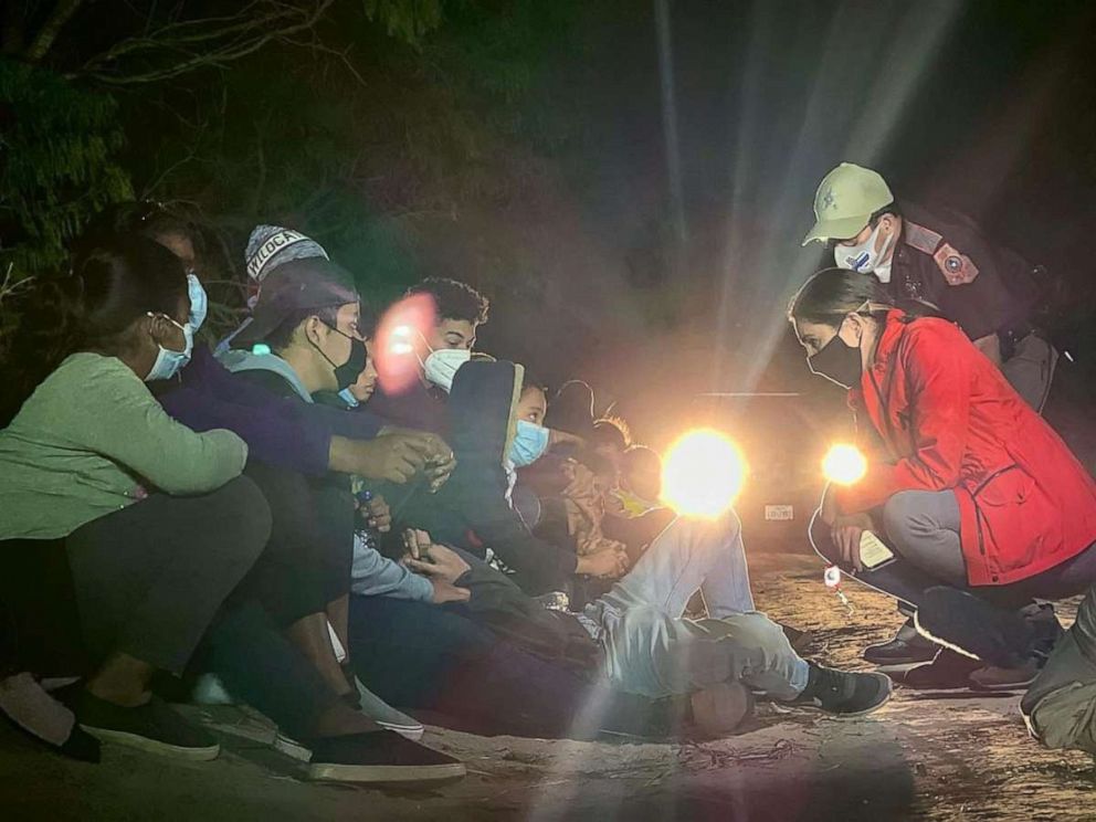 PHOTO: ABC News' Cecilia Vega speaks with two young boys who were traveling alone while attempting to reach relatives in the United States, at the U.S. Border in March 2021.