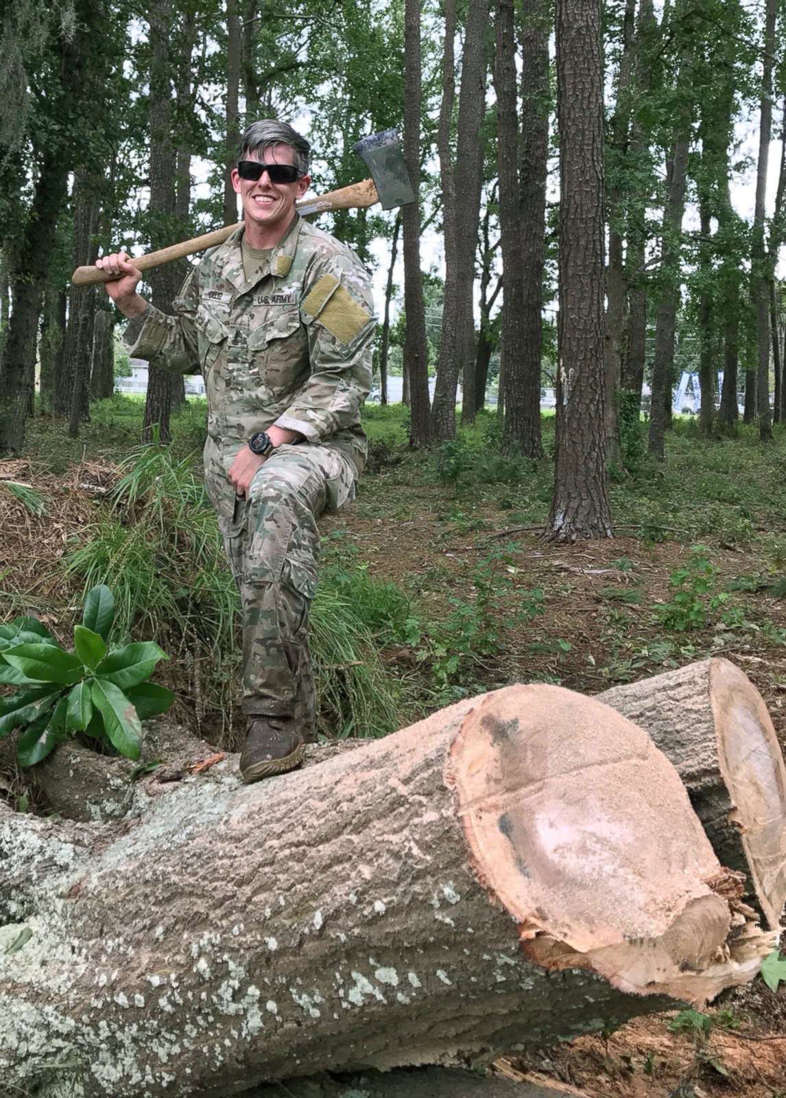 PHOTO: Sgt. 1st Class Christopher Celiz helping clear debris with fellow soldiers in the aftermath of a hurricane. 