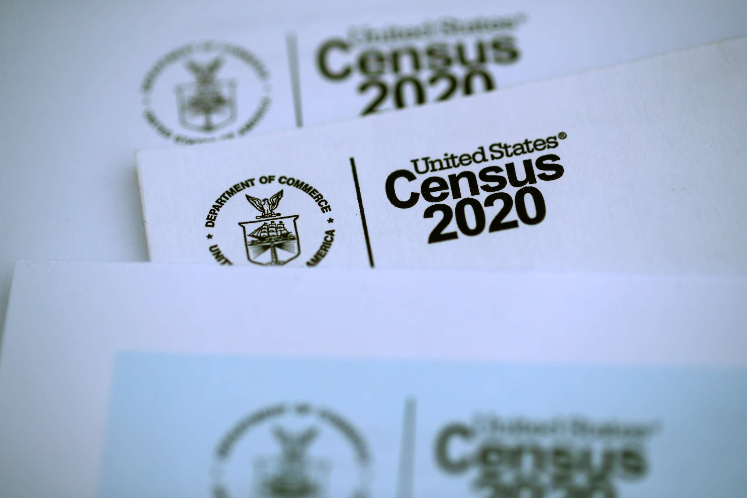 PHOTO: In this March 19, 2020, file photo, the U.S. Census logo appears on census materials received in the mail with an invitation to fill out census information online, in San Anselmo, Calif.