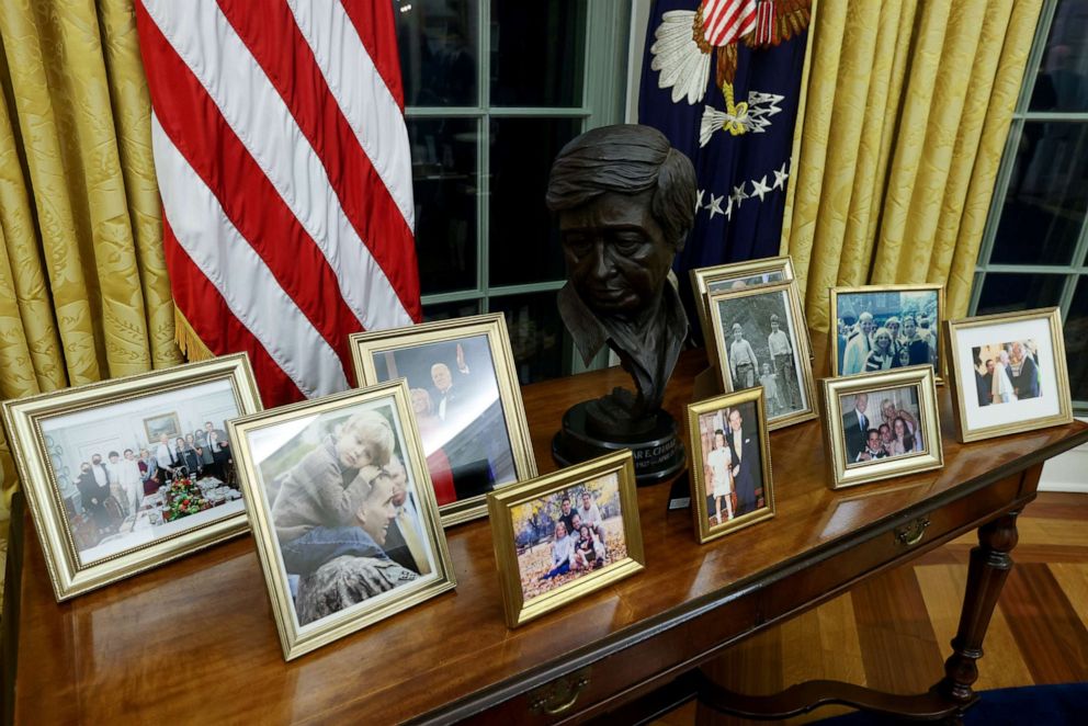 PHOTO: A bust of Mexican American labor leader Cesar Chavez joins family photos in the Oval Office, newly decorated for President Joe Biden at the White House in Washington, Jan. 21, 2021.
